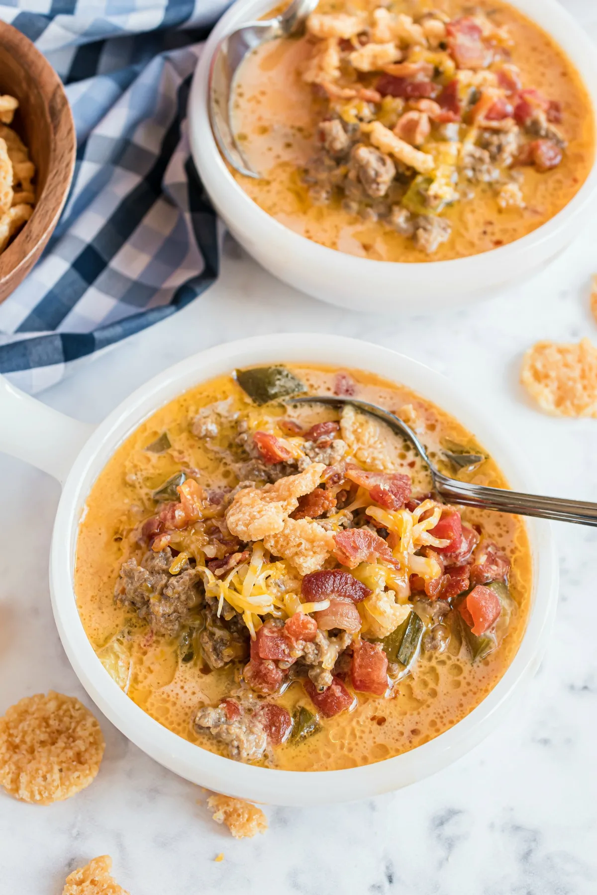 White dinner bowls with low carb cheeseburger soup.