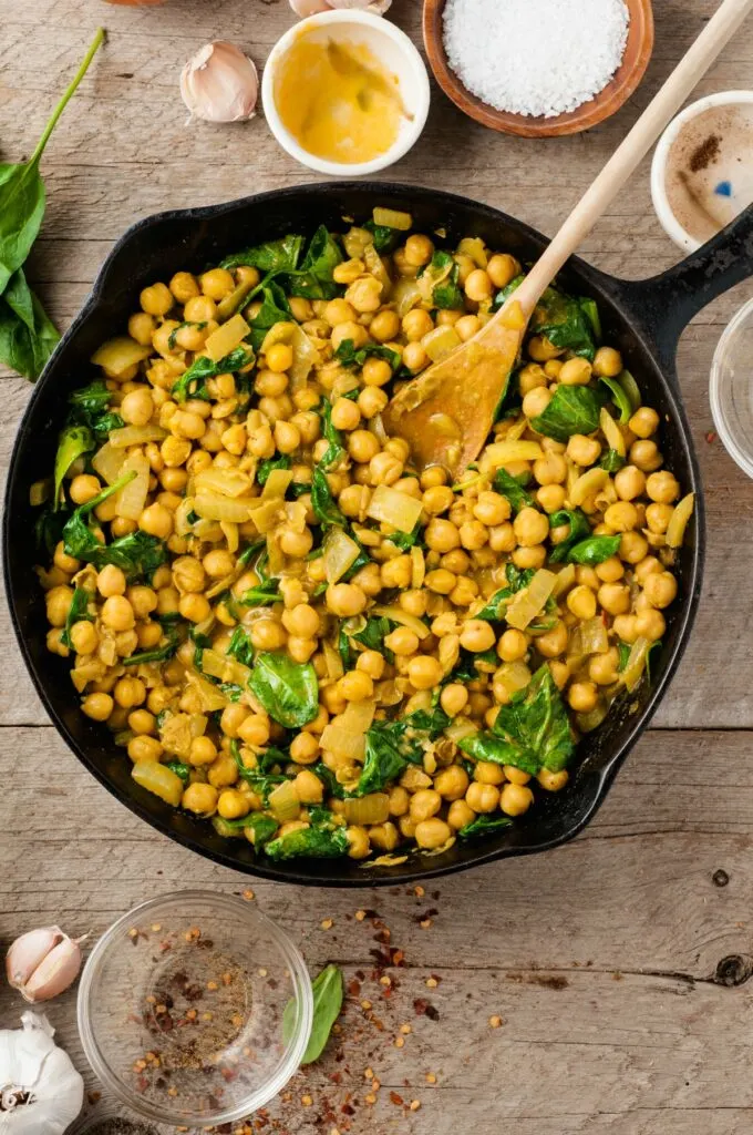Fragrant and creamy Chickpea Curry is a vegetarian meal that comes together in under 30 minutes! Made with coconut milk and curry spices, this  may become your new favorite weeknight meal. 