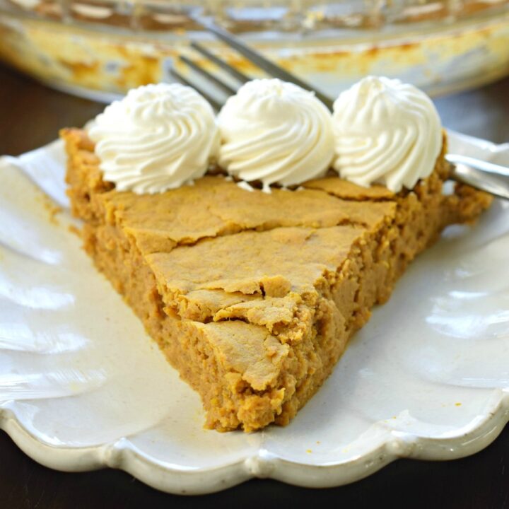 Slice of pumpkin pie with whipped cream and no sugar.