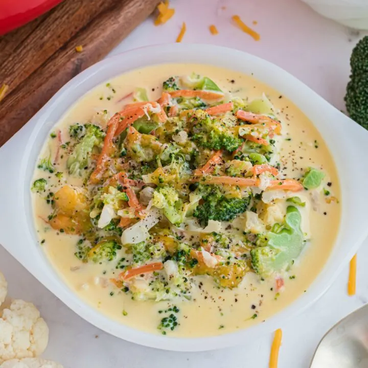 Copycat Panera Broccoli Cheese Soup - Unbelievably creamy broccoli soup with vibrant cheddar flavor tastes even better when you make it at home! This version of the popular Panera dish includes cauliflower, carrots and no added sugar or flour.