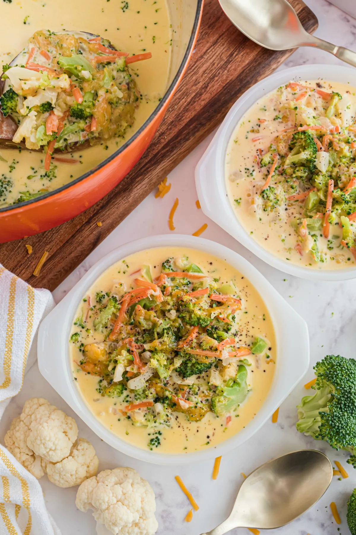 Broccoli cheddar soup served in small bowls.