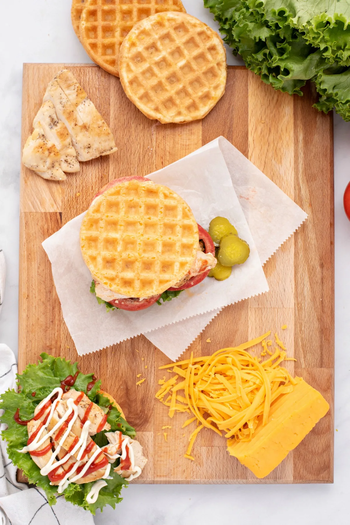 Chaffles being used as a bun for a chicken sandwich.