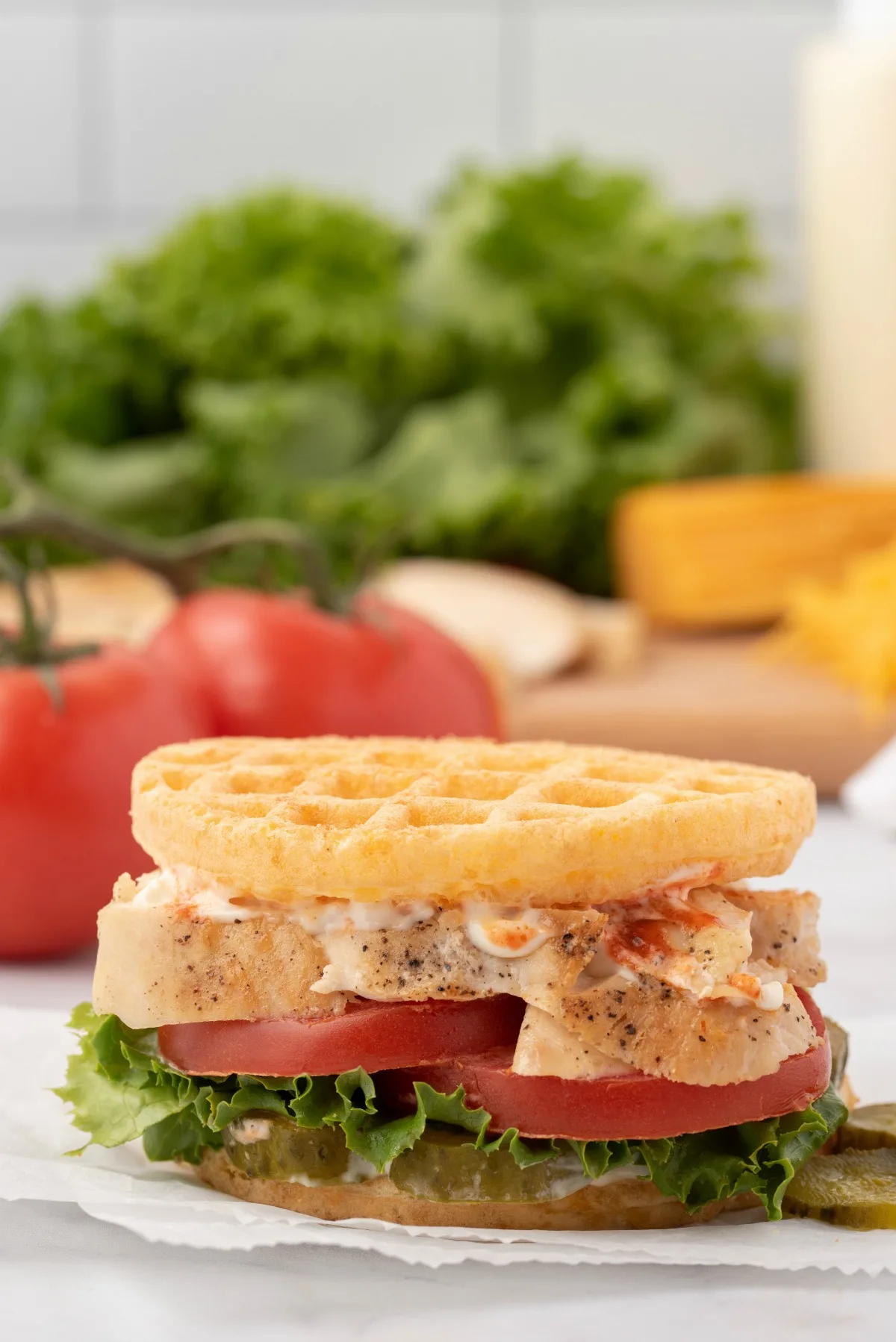 Grilled chicken and cheddar cheese on a chaffle.