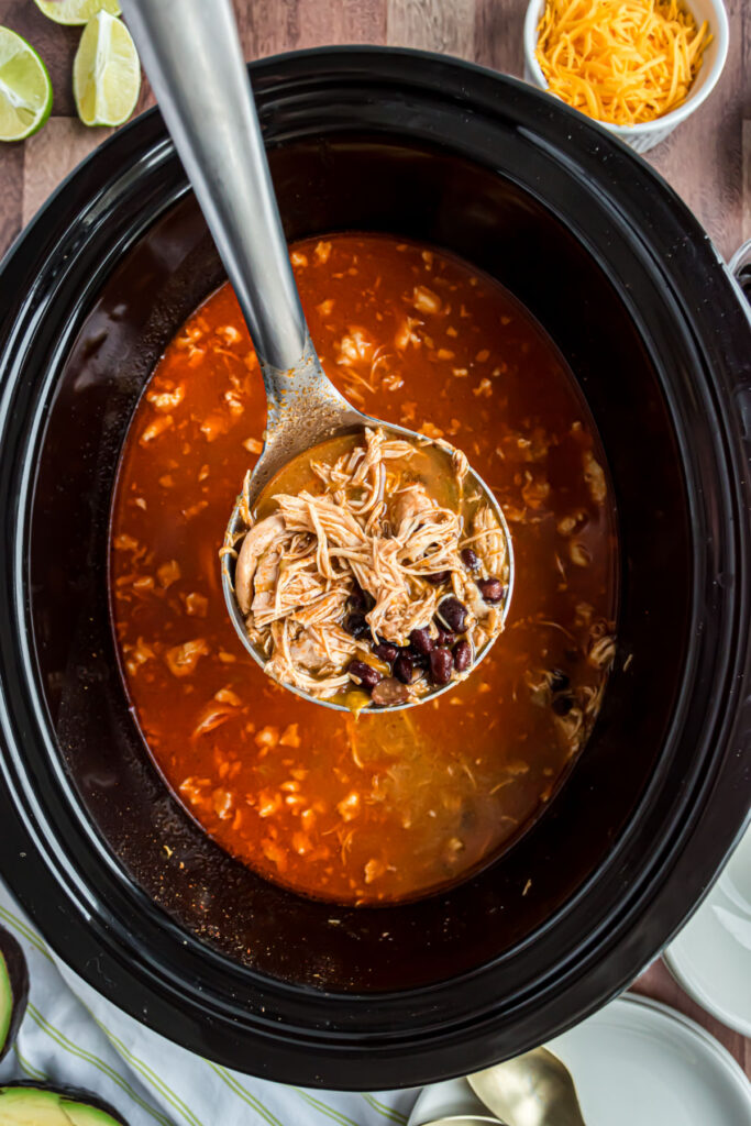 Slow cooker with chicken enchilada soup.