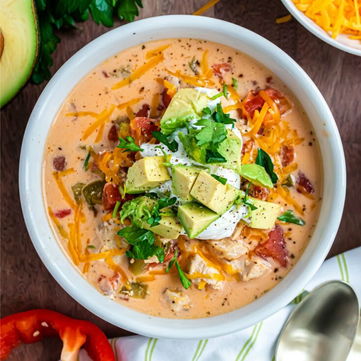 A bowl of flavorful Chicken Fajita Soup is just what you need to warm you up! Made in the Instant Pot, this creamy, spicy low carb soup recipe will be ready to eat in no time.