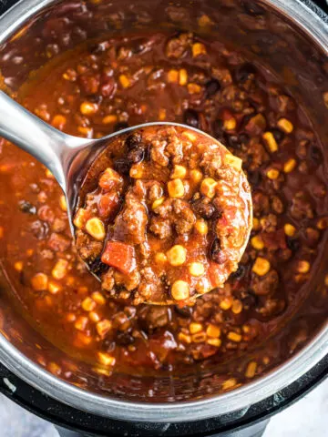 Taco chili made in the Instant Pot being ladled out.