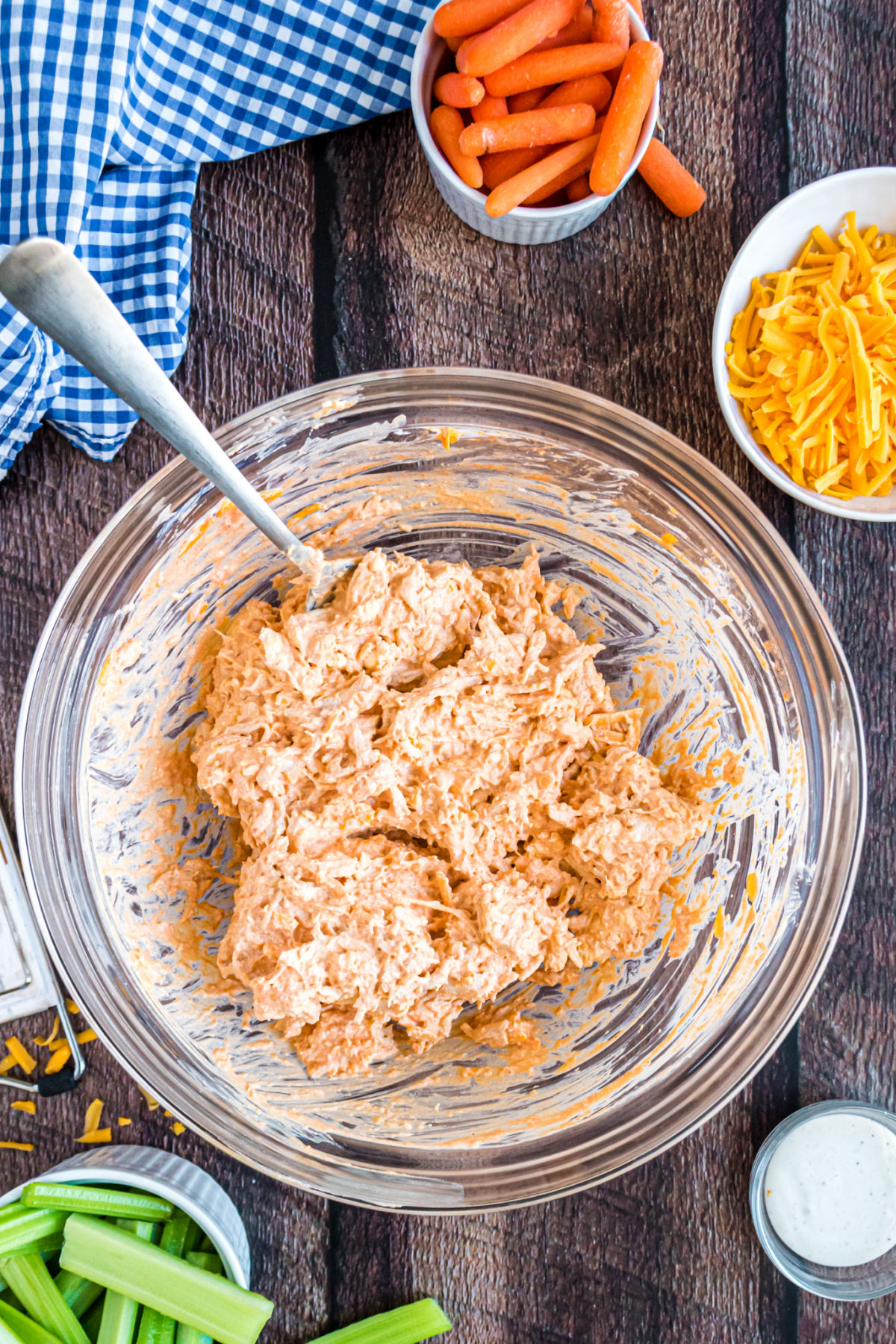 Buffalo chicken dip in a mixing bowl before cooking.