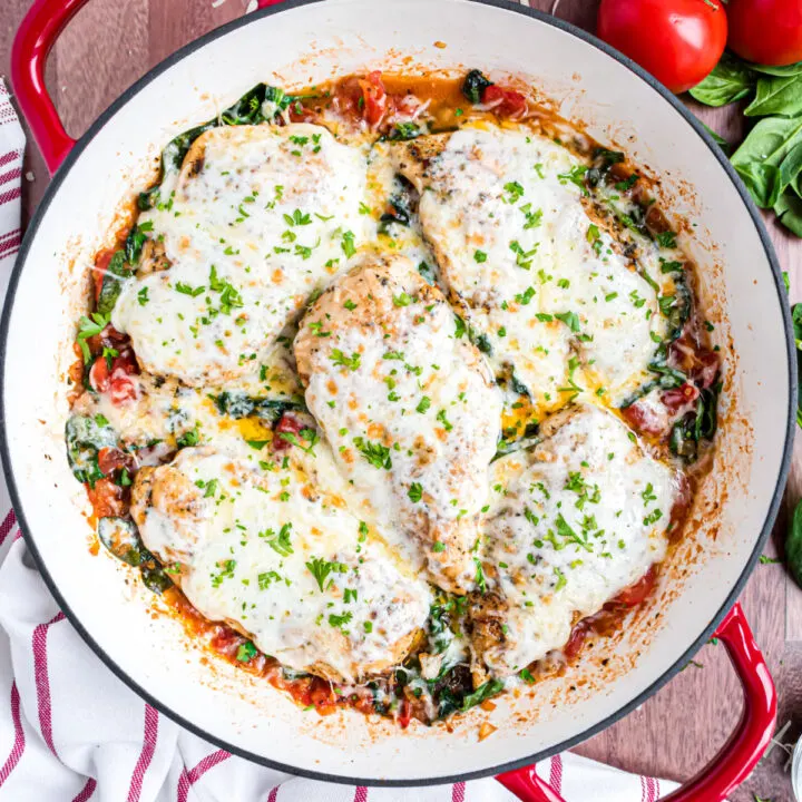 Herb seasoned chicken breast, spinach and plenty of cheese come together for an easy one pan meal. Simple ingredients come together to create big flavor in this hearty and nourishing Chicken Spinach Skillet dinner!