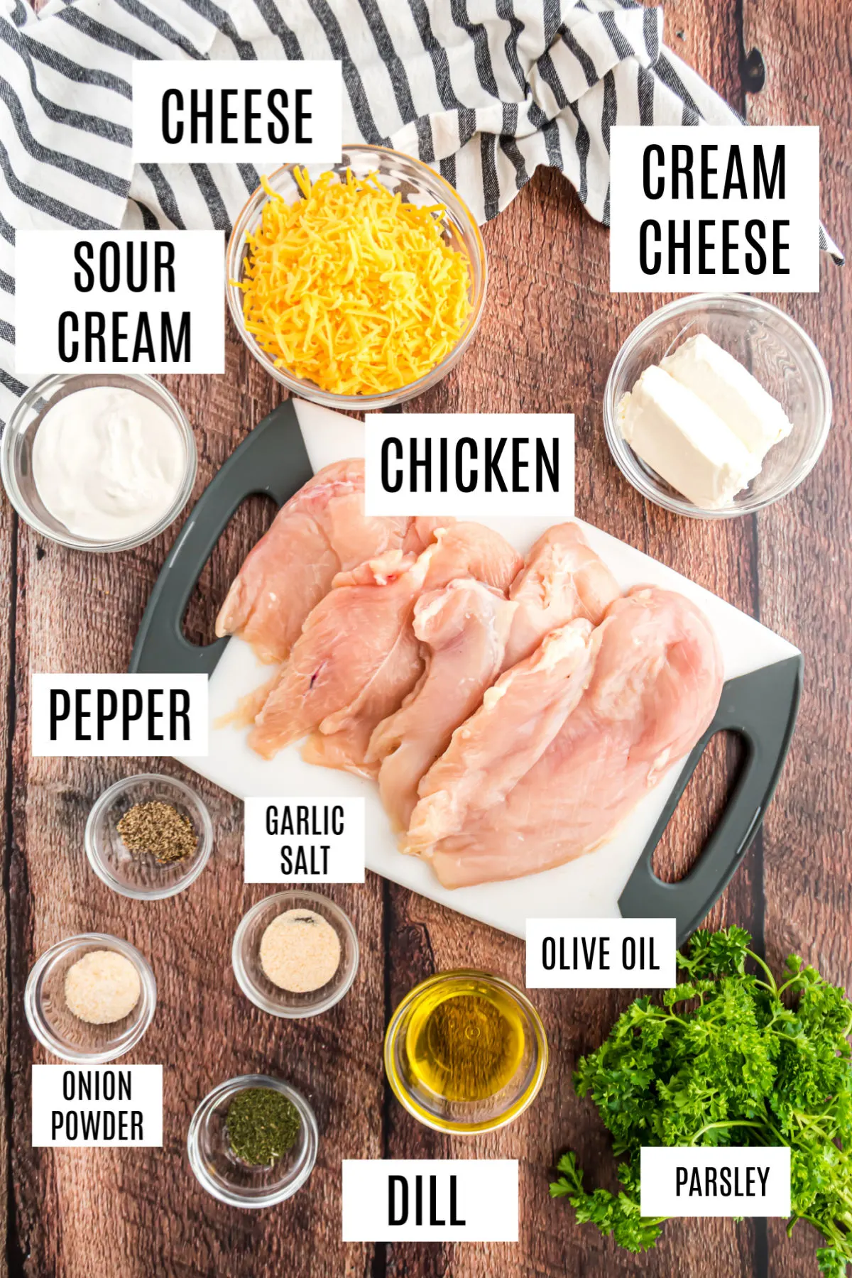 Ingredients needed for baked ranch chicken on wooden counter.