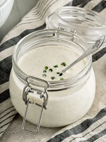 Homemade ranch dressing in mason jar with latch.