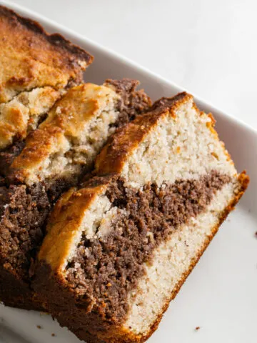 Banana bread slice with a swirl of chocolate in the middle.
