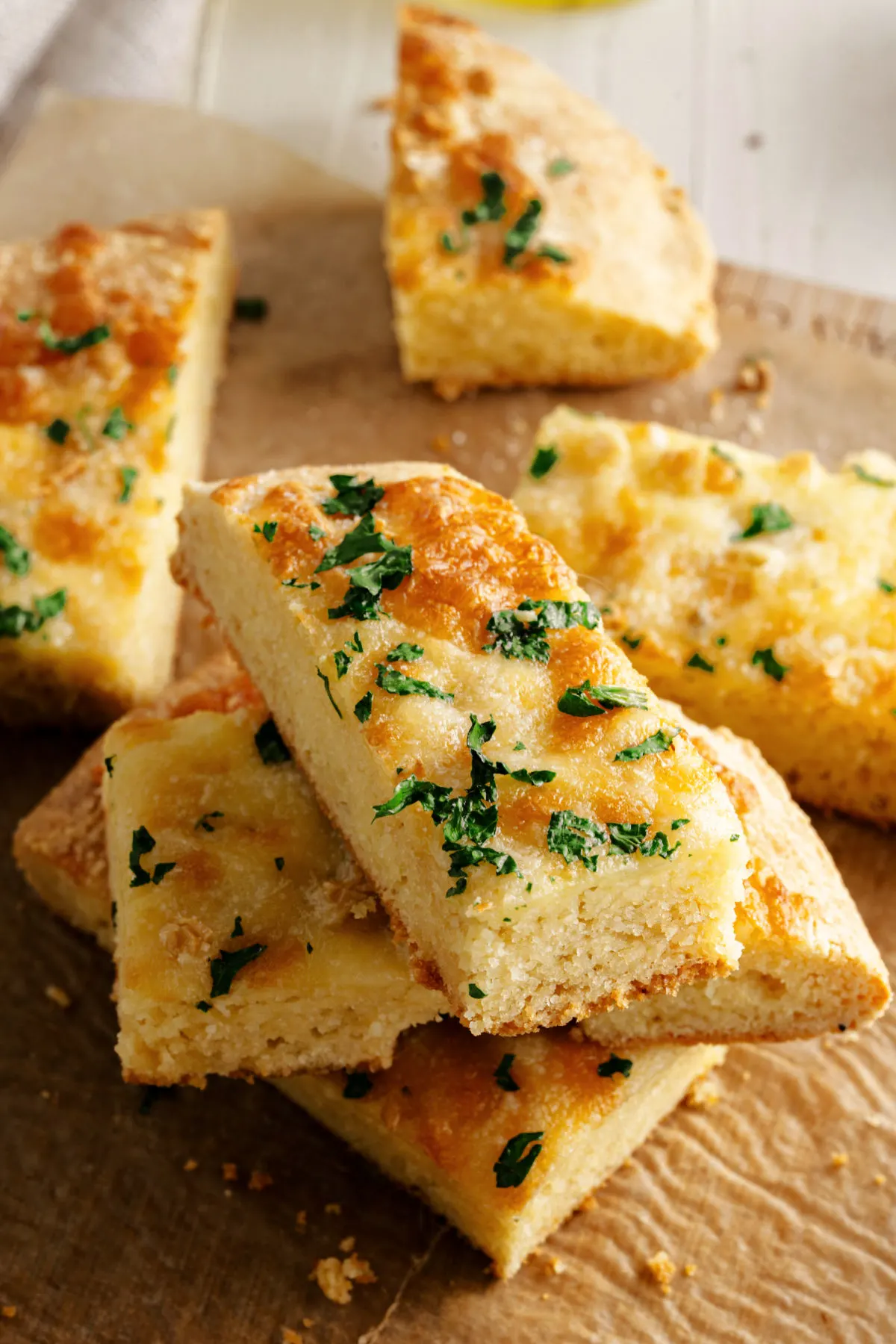 Garlic bread cut into pieces and stacked on each other.