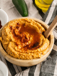 Spicy chipotle hummus in a wooden bowl for serving.