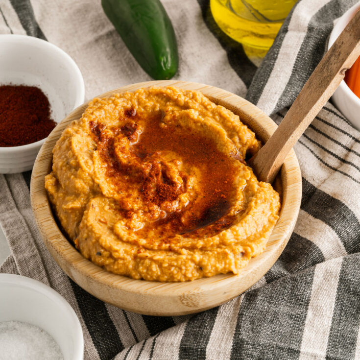 Spicy chipotle hummus in a wooden bowl for serving.