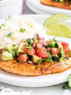 This Cilantro Lime Chicken is easy, versatile and full of flavor. Cooked on the grill or the stove top, marinated chicken is topped with a fresh avocado salsa for a healthy great tasting dinner.