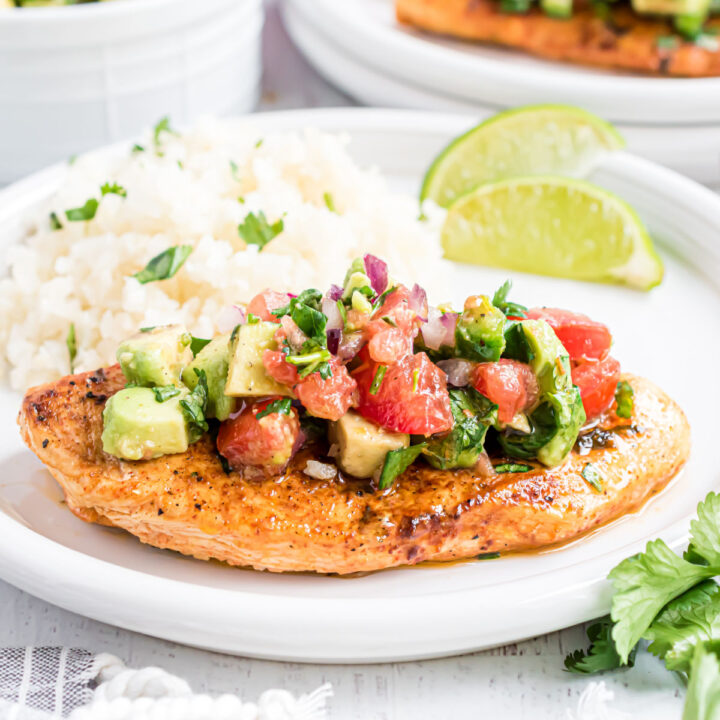 This Cilantro Lime Chicken is easy, versatile and full of flavor. Cooked on the grill or the stove top, marinated chicken is topped with a fresh avocado salsa for a healthy great tasting dinner.