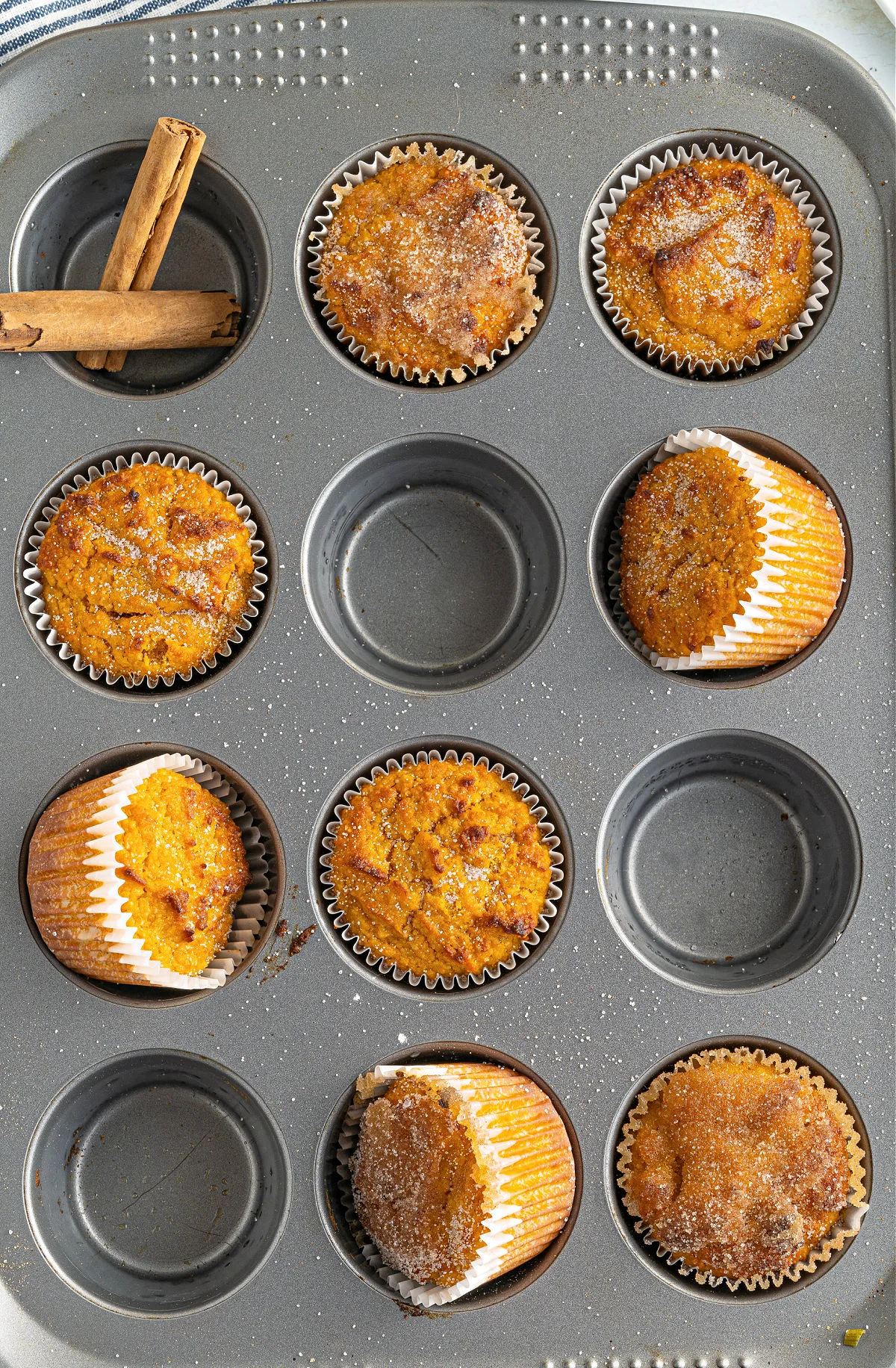 Pumpkin muffins in a muffin tin.