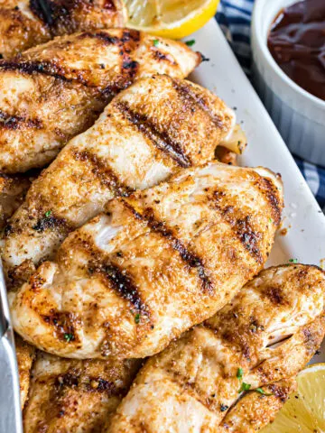 Grilled Chicken Tenders are the perfect easy meal starter! Seasoned with garlic, cumin, and paprika, this chicken is packed with protein and flavor. Dinner is off the grill and on the table in no time.