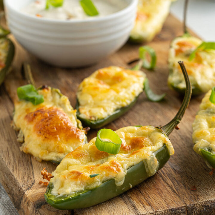 Baked jalapenos on serving tray.