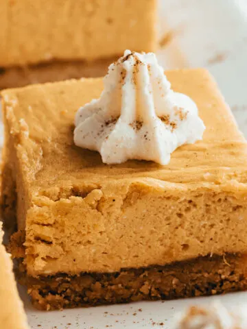 This Keto Pumpkin Cheesecake is sweet, creamy and full of pumpkin flavor! Low in carbs and free of refined sugar, you can feel good about serving this at your holiday gathering--or any time of year.