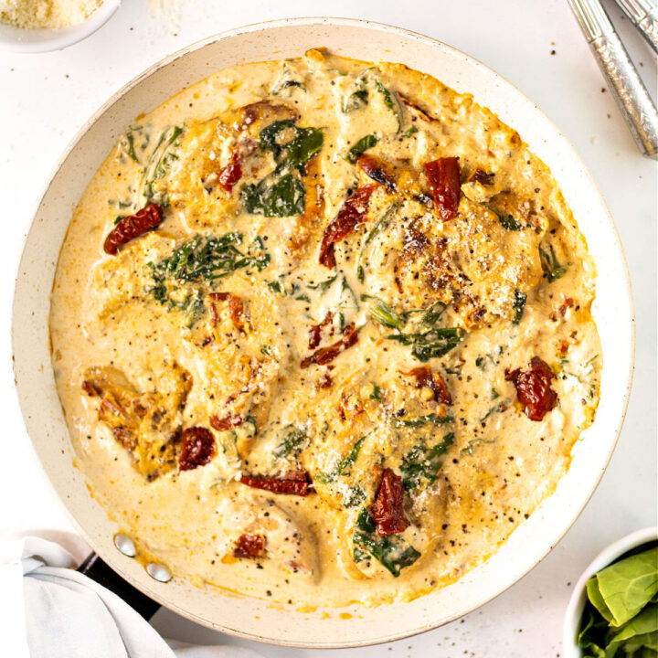Bring flavors of Italy to your dinner table with this Keto Tuscan Chicken recipe. Pan cooked chicken is covered with a creamy Parmesan sauce and sundried tomatoes for a low carb meal everyone will rave over.