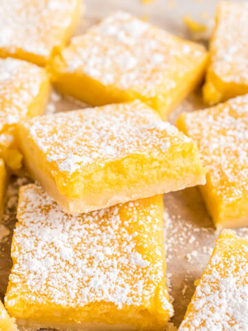 Sugar free lemon bars stacked on top of each other.