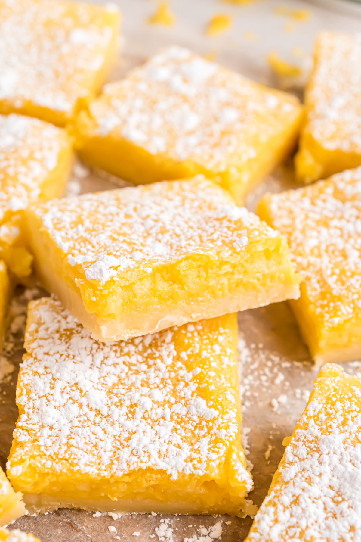 Sugar free lemon bars stacked on top of each other.