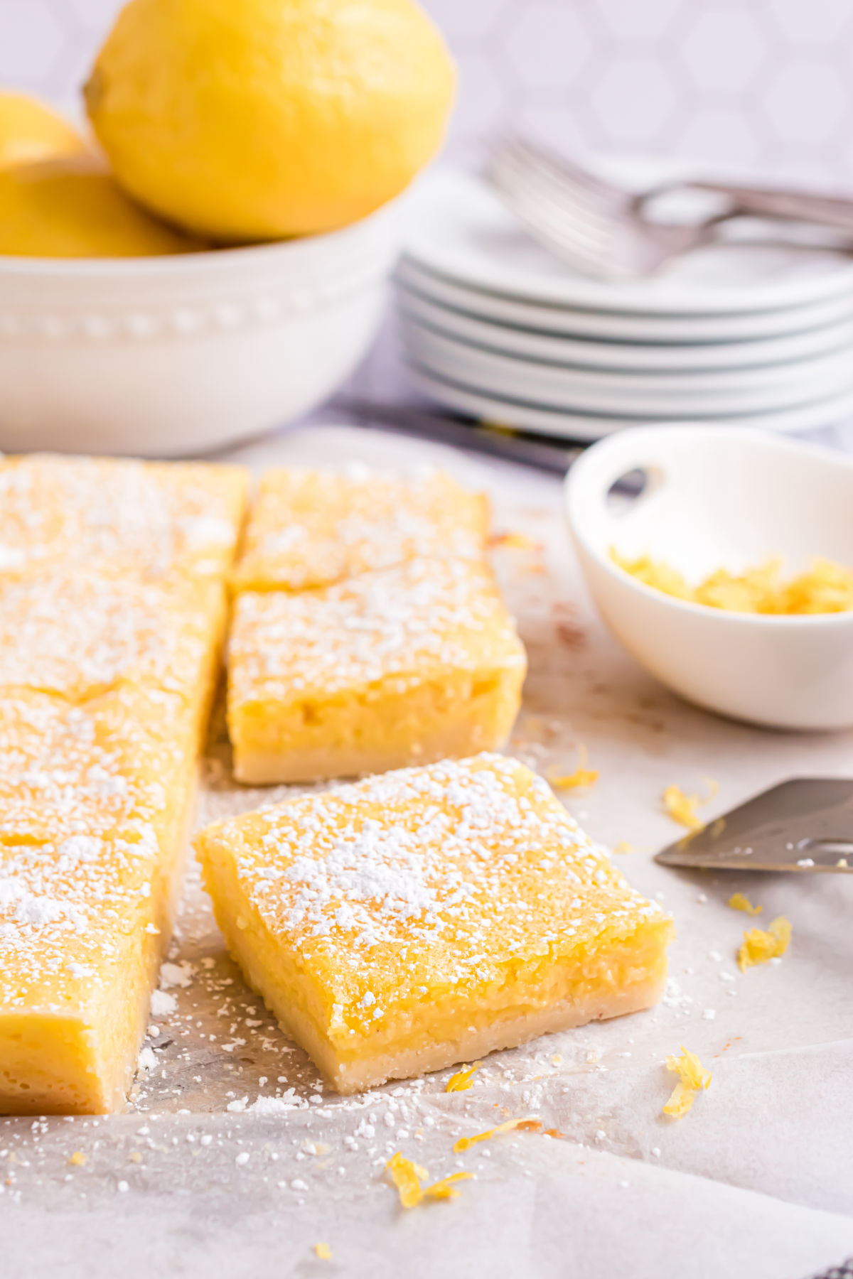Lemon bars cut into squares and dusted with powdered monk fruit. 
