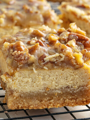 Keto Pecan Cheesecake Bars have a rich cream cheese center and a buttery shortbread crust. A homemade caramel and pecan topping makes this sugar free dessert even better!