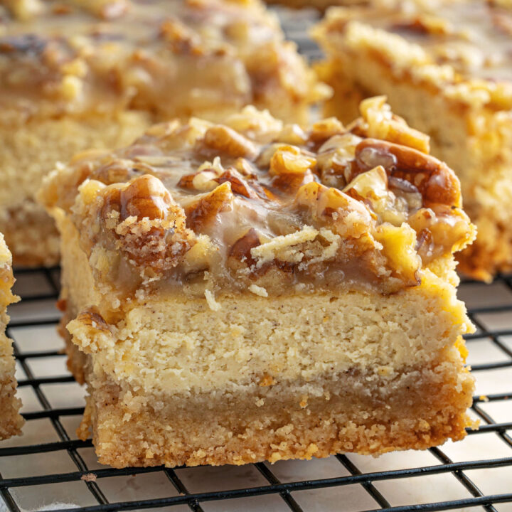 Keto Pecan Cheesecake Bars have a rich cream cheese center and a buttery shortbread crust. A homemade caramel and pecan topping makes this sugar free dessert even better!