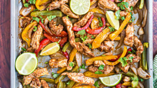 Sheet Pan Chicken Fajitas are an easy weeknight meal the whole family loves. All you need is this fajita seasoning mix to turn chicken and peppers into delicious fajita bowls!