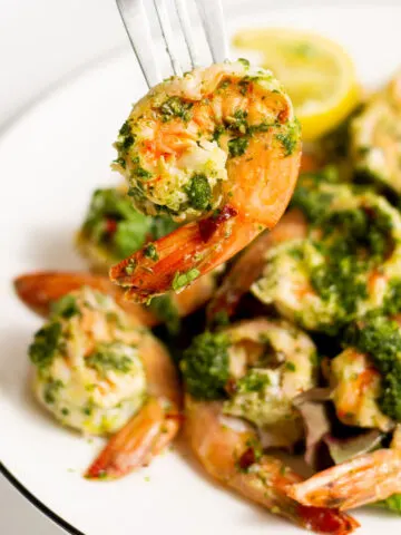 Chimichurri Shrimp is a healthy meal with a lots of fresh, zesty flavor. Shrimp is marinated in a cilantro chimichurri sauce then lightly grilled for a delicious easy meal that's ready in minutes!
