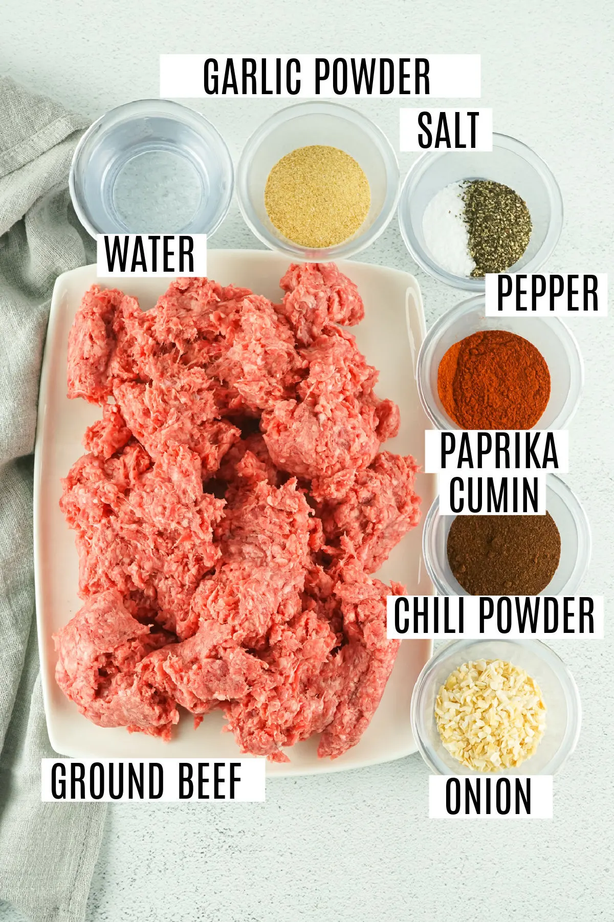 Ingredients needed to make taco meat in the slow cooker.