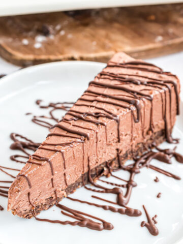 This Keto Chocolate Cheesecake has a homemade almond crust and luscious creamy chocolate filling. This no sugar, no bake cheesecake is easy to make for any occasion!