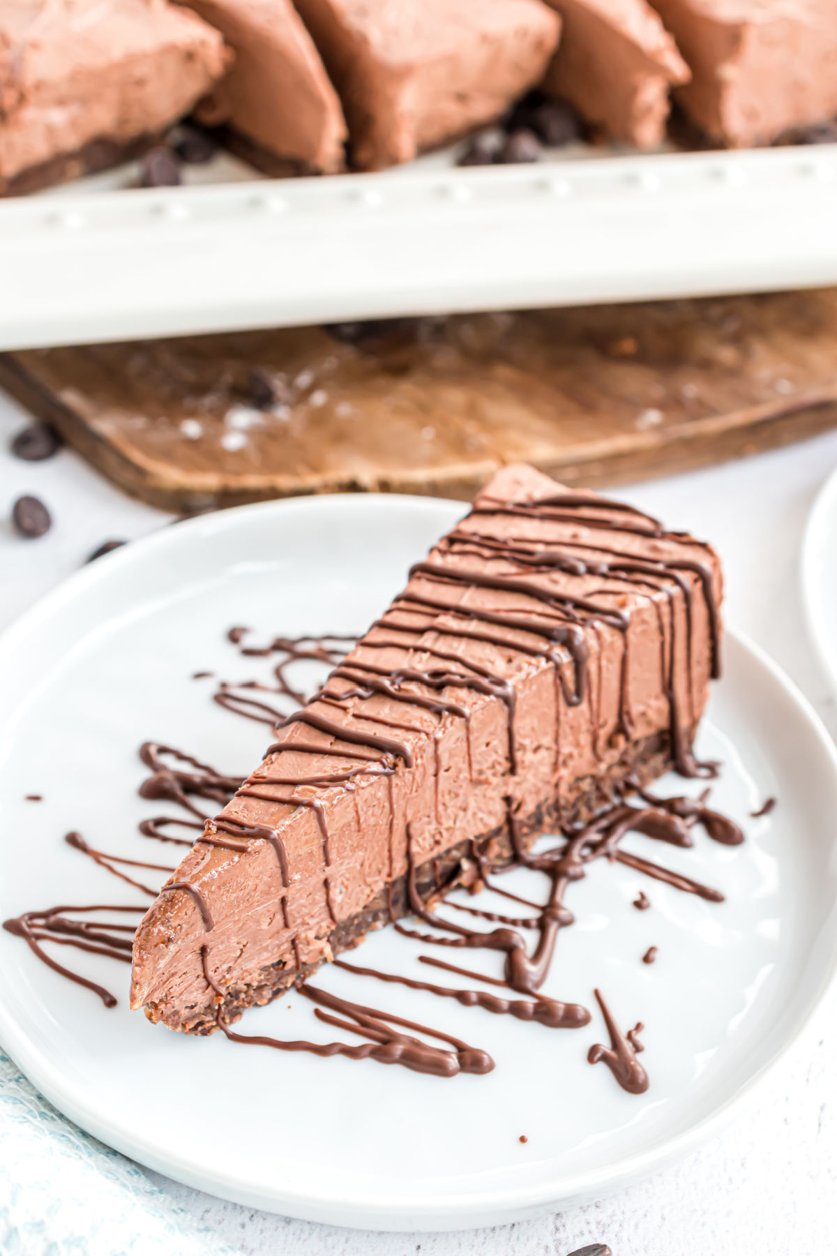 Sugar free chocolate cheesecake sliced and on a dessert plate.
