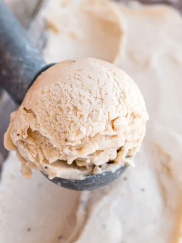 Dairy free Banana Ice Cream will satisfy your sweet tooth with no added sugar! This recipe transforms frozen bananas into a luscious frozen dessert. It's a delicious imposter for soft serve ice cream--without the extra ingredients!