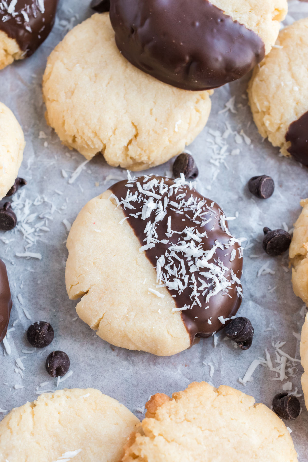 Coconut cookies dipped in a melted chocolate and flaked coconut.