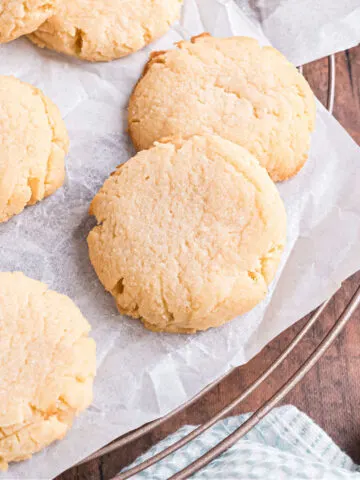 These Keto Coconut Cookies are buttery, rich and bursting with coconut flavor. Make perfect coconut shortbread cookies with no added sugar or flour with this 5-ingredient recipe!