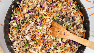 This keto Egg Roll Bowl is a one-skillet recipe that's packed with protein and flavor. Ground pork and cabbage are cooked with plenty of garlic and ginger to make a deconstructed version of the familiar Asian dish.