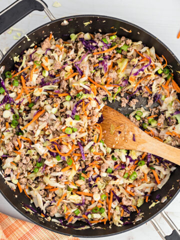 This keto Egg Roll Bowl is a one-skillet recipe that's packed with protein and flavor. Ground pork and cabbage are cooked with plenty of garlic and ginger to make a deconstructed version of the familiar Asian dish.