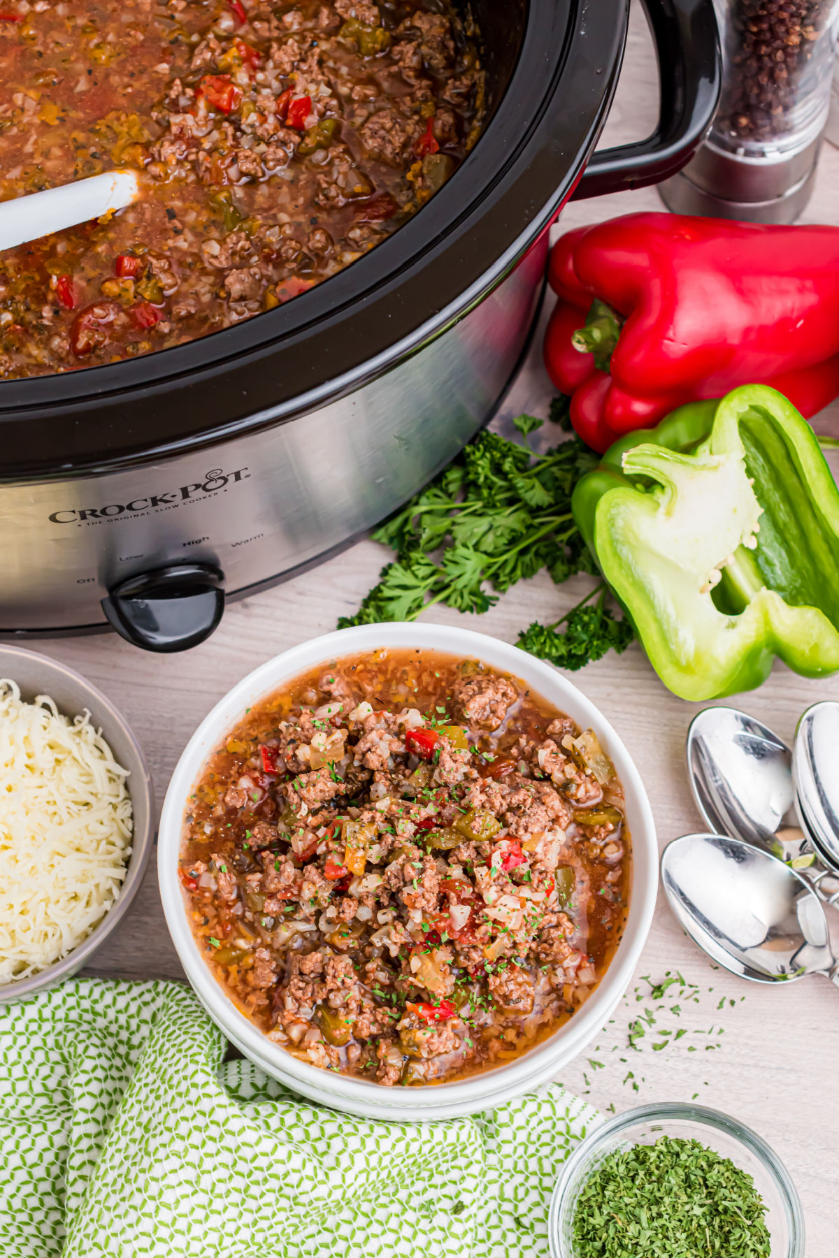 Stuffed pepper soup in the crockpot and served in a white bowl.
