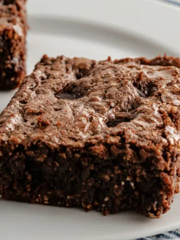 Almond Flour Brownies are the absolute best keto brownies! These thick, fudgy brownies taste so chocolatey and decadent, you won't miss the gluten or the sugar.