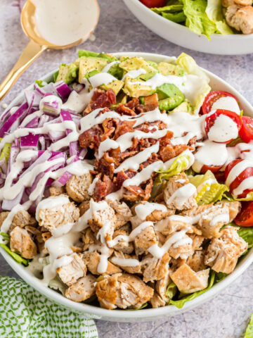 A Chicken Bacon Ranch Salad is the perfect power meal! Grilled chicken breasts and bacon are tossed with fresh veggies and homemade dressing for a satisfying low-carb lunch!