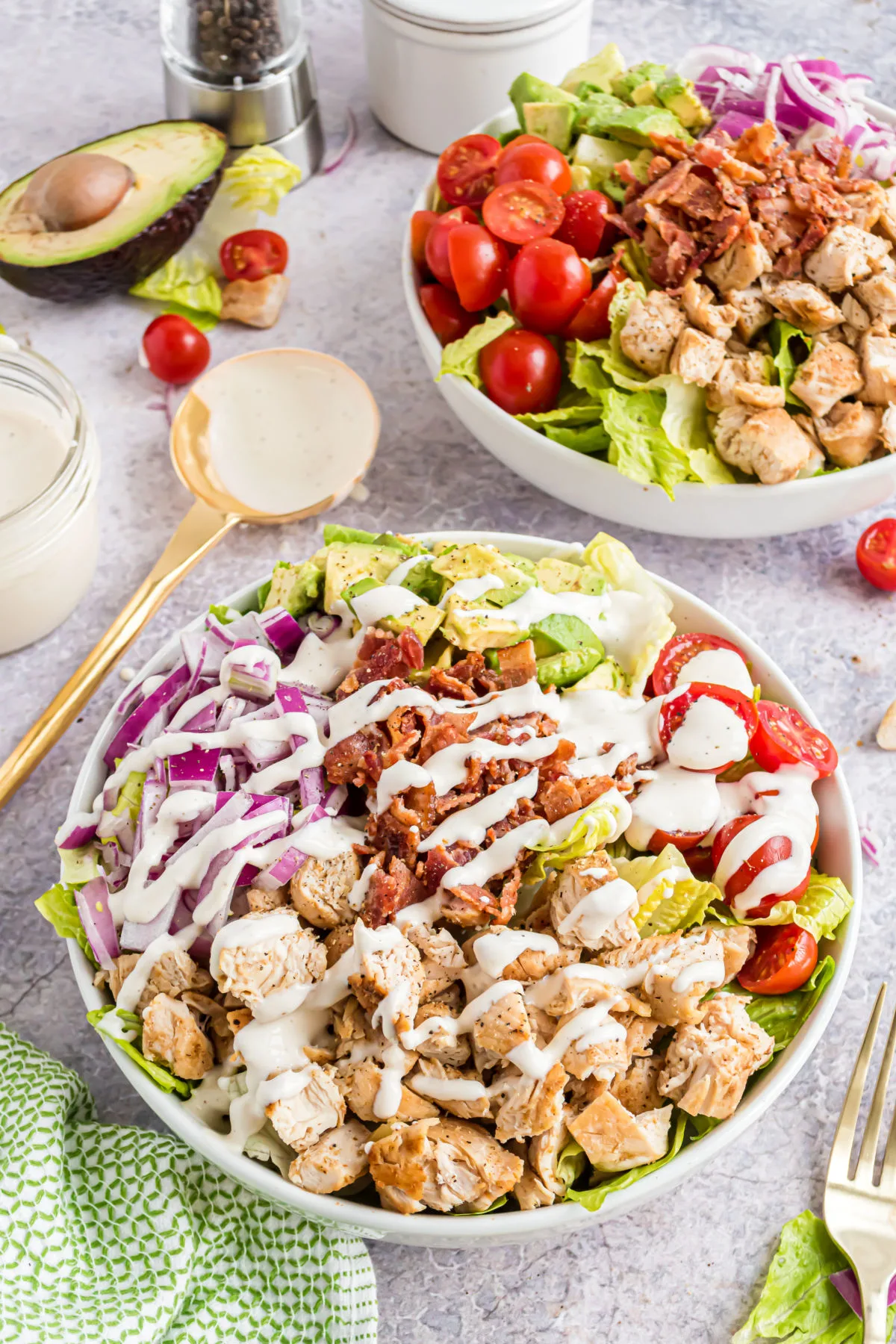 Chicken bacon salad drizzled with ranch dressing.