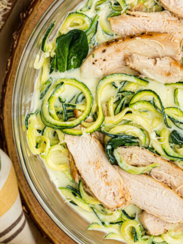 Chicken alfredo zoodles in a skillet.