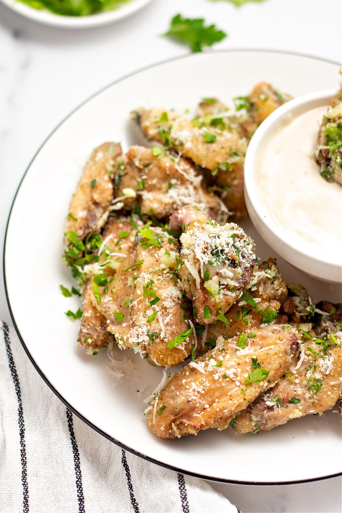 Garlic parmesan chicken wings with homemade ranch dressing.