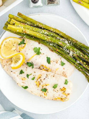 This Lemon Butter Tilapia is a restaurant quality dish made at home! A simple garlic and lemon sauce elevates fish filets to extraordinary heights of flavor and aroma. Ready in minutes, it's easy to make any night of the week but impressive enough for a special occasion!