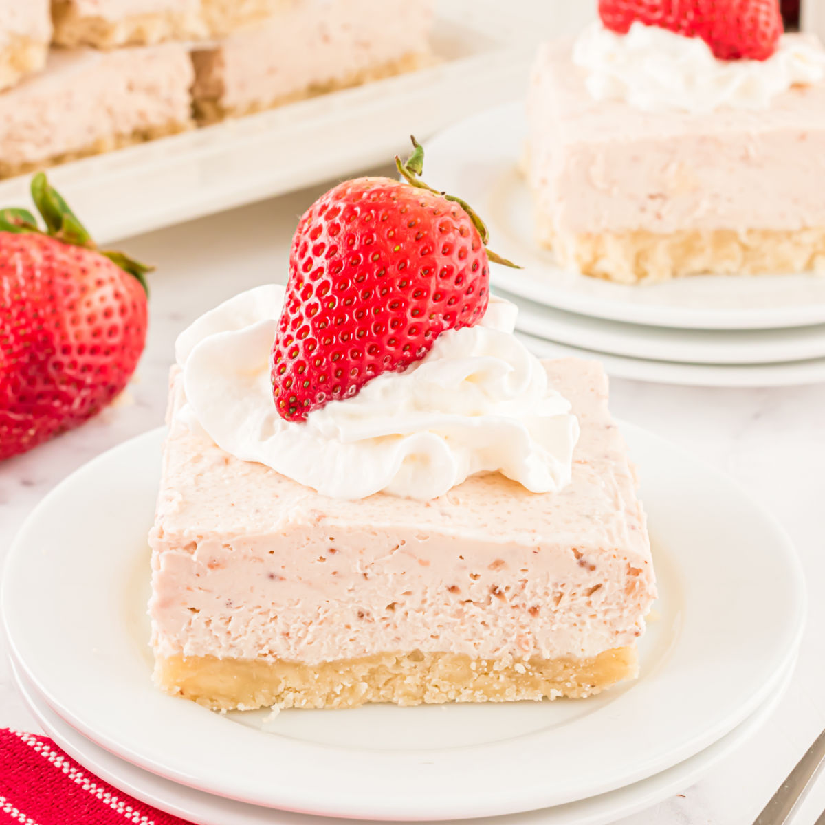 This No Bake Strawberry Cheesecake is an answer to prayer. A creamy cheesecake filling is packed with sweet strawberry flavor on top of a homemade gluten free crust. Made without added sugar, it just might be the perfect cheesecake recipe!