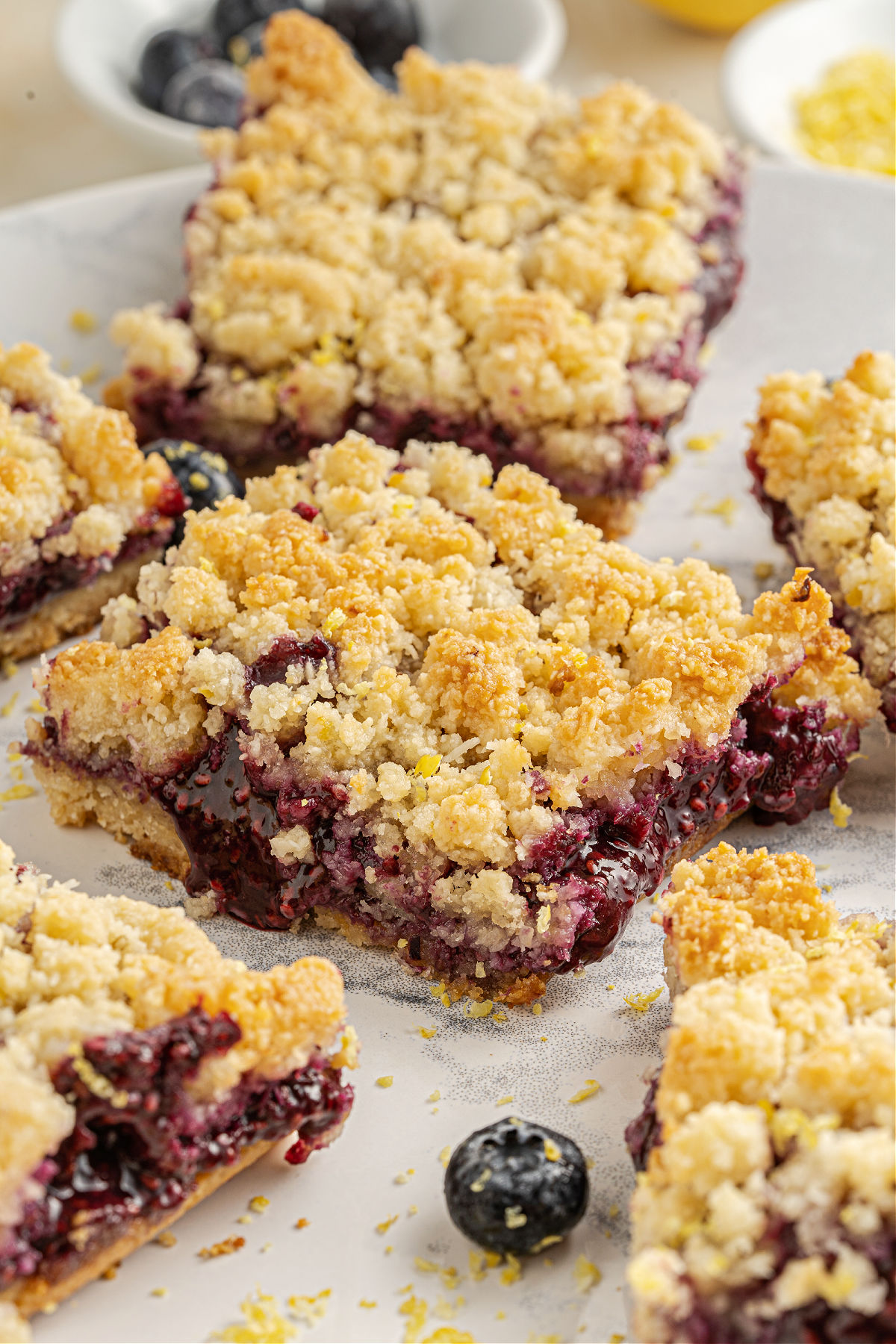 Crumble bars with berry filling cut into squares.