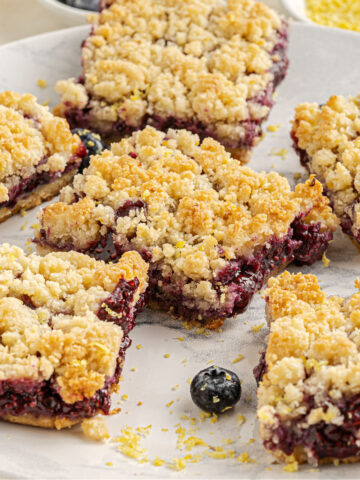 Berry Crumble Bars are easy to make, low carb and bursting with the sweetness of fresh berries! A zesty coconut crumb topping makes these delicious dessert bars even better. No added sugar or flour needed!